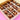 Gourmet Brownies with chocolate drizzle and nutty toppings