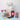 Assorted chocolate and confectionery items on a light blue surface with a white background