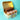 Chocolate loaf cake and cupcakes with sprinkles in a box on a turquoise background