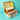Open box containing a cake and cupcakes with sprinkles on a teal background