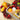Fruit box with fruits and cookies on a wooden surface