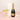 Perrier Jouet champagne bottle with two glasses on a pink background
